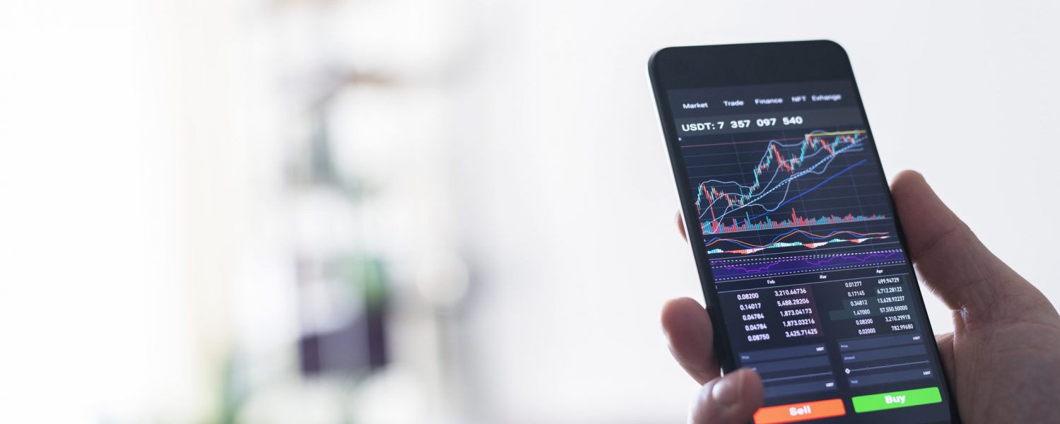 Unrecognisable businesswoman reading financial stock market analysis on smartphone.